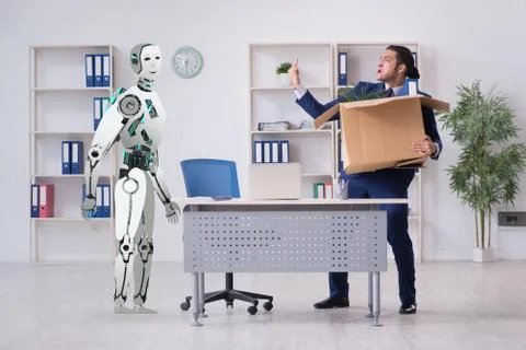 Concept of robots replacing humans in offices Stock Photos