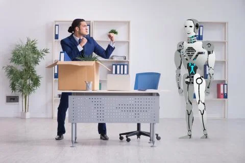 Concept of robots replacing humans in offices Stock Photos