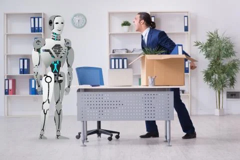 Concept of robots replacing humans in offices Stock Photos