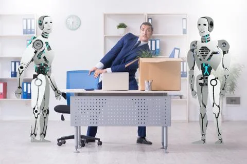 Concept of robots replacing humans in offices Stock Photos