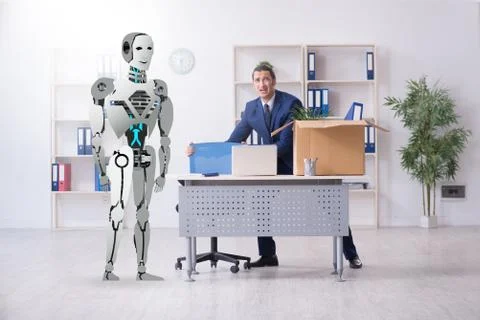 Concept of robots replacing humans in offices Stock Photos