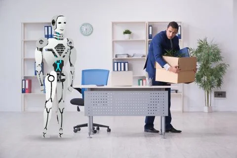 Concept of robots replacing humans in offices Stock Photos