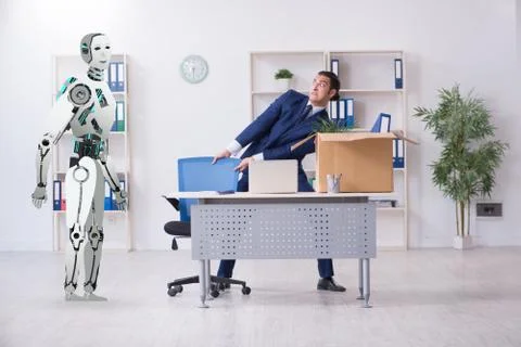 Concept of robots replacing humans in offices Stock Photos