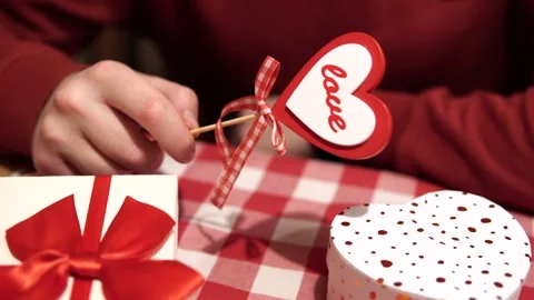 Concept of a romantic date in a restaurant. Man prepared a gift for his beloved Stock Footage 170195247