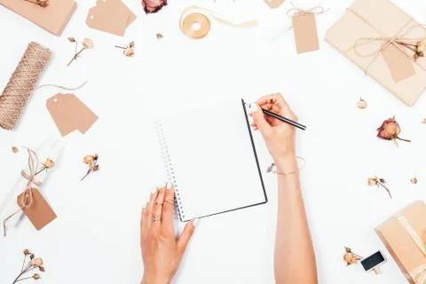 The concept of romantic diary: flat lay arrangement of female hands Photos