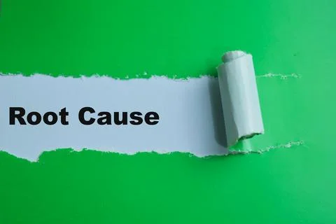 Concept of Root Cause Text written in torn paper. Stock Photos