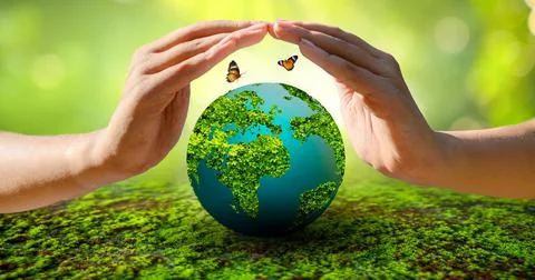 Concept Save the world save environment The world is in the grass of the gree Stock Photos