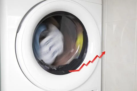 Concept of saving electricity with a washing machine white electrical power Stock Photos