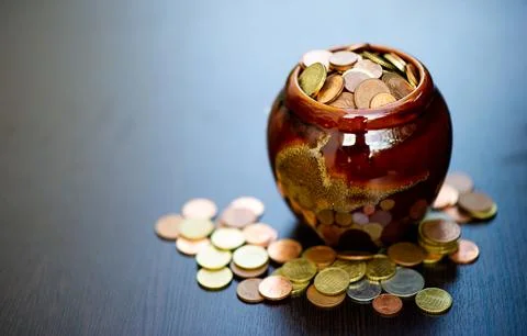 The concept of saving money predefined by saving coins for a growing busine.. Stock Photos