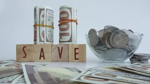 The concept of saving money using wooden blocks Stock Footage 333036911