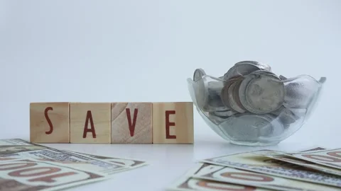 The concept of saving money using wooden blocks Stock Footage 333036933