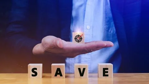 Concept of saving planning strategy, Hand choose the wooden cube block with.. Stock Photos