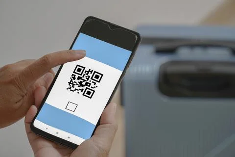 Concept of scanning a mobile QR CODE on a mobile phone. Stock Photos