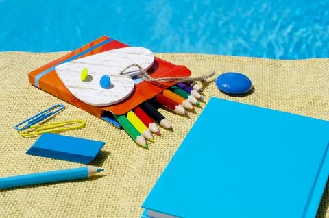 The concept of the school on the background of burlap and blue water of the p Stock Photos