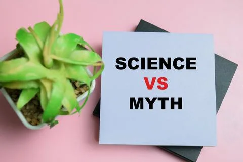 Concept of science vs myth write on sticky notes isolated on table. Stock Photos