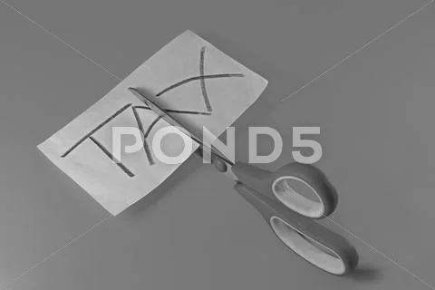 Concept, scissor cutting the word tax Stock Photos