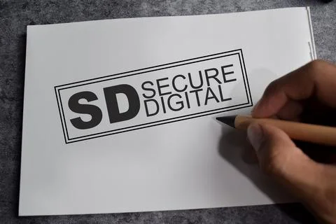 Concept of SD - Secure Digital write on book isolated on Wooden Table. Stockfoto's