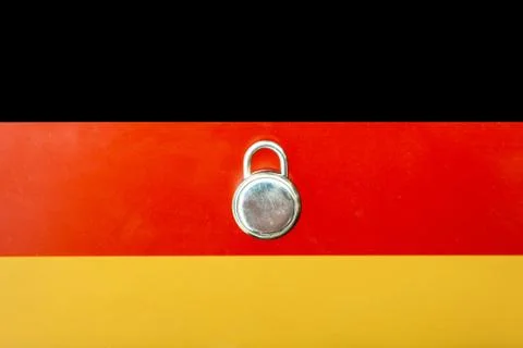 Concept Of Second Lockdown in Germany. Real padlock placed on top of the Germ Stock Photos