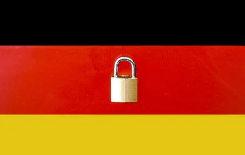 Concept Of Second Lockdown in Germany. Real padlock placed on top of the Germ Stock Photos