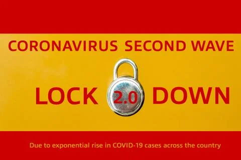 Concept Of Second Lockdown in Spain. Real padlock placed on top of flag of Sp Stock Photos