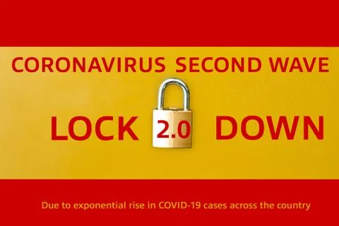 Concept Of Second Lockdown in Spain. Real padlock placed on top of flag of Sp Stock Photos