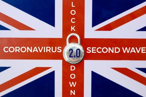 Concept Of Second Lockdown in UK. Real padlock placed on top of Union Jack fl Stock Photos