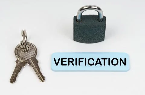 The concept of security in business. On a white surface there is a lock, keys Stock Photos
