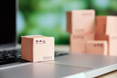 Concept of sending and tracking cargo online by box on a laptop Stock Photos