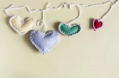 The concept is a set of colored hearts, with a colored background. Stock Photos