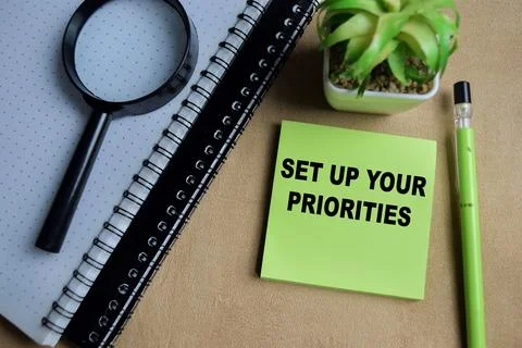 Concept of set up your priorities write on sticky notes Stock Photos