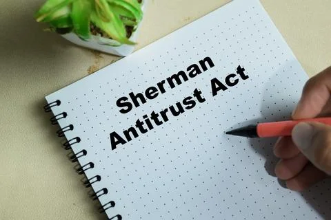 Concept of Sherman antitrust act write on book isolated on Wooden Table 스톡 사진