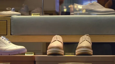 Concept Shoe store in the Mall. New collection is neatly displayed in the shop Stock Footage 79018232