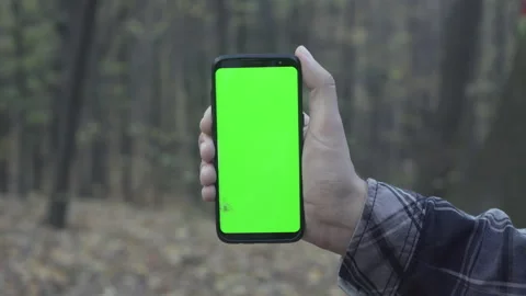 Concept shot of crashed green screen hand of young man holding chroma key Stock Footage 134384234