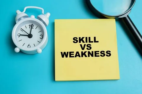 Concept of skill vs weakness write on sticky notes isolated on table. Stock Photos