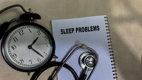 Concept of Sleep Problems write on book isolated on Wooden Table. Stock Photos