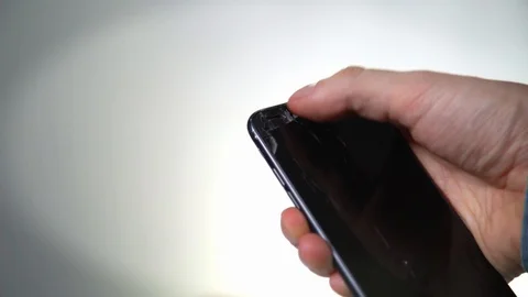 Concept of smart phone with broken screen. Top view of man hands holding a phone Stock Footage 128697871