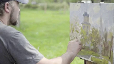 Concept Snow-white Spring. Skilled Artist Draws Paints of Blossoming Apple Tree Stock Footage 70733826