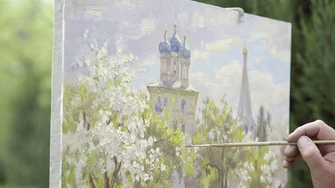 Concept Snow-white Spring. Skilled Artist Draws Paints of Blossoming Apple Tree Stock Footage 70734094
