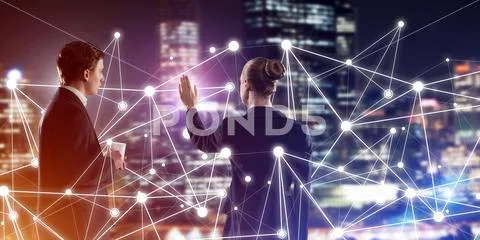 Concept of social connection and networking against night city view and partners Stock Photos