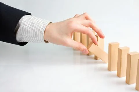 Concept for solution to a problem by stopping the domino effect 写真素材