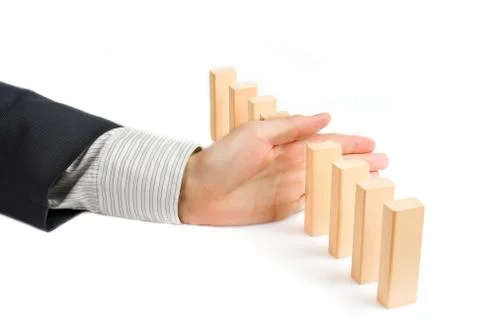 Concept for solution to a problem by stopping the domino effect Stock Photos