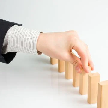 Concept for solution to a problem by stopping the domino effect Stock Photos