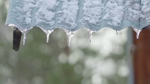 Concept of spring icicles melting in the sun and snow Stock-Footage 74514038