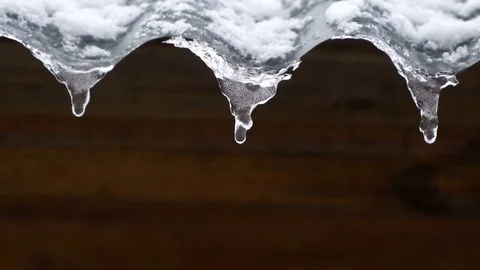 Concept of spring icicles melting in the sun and snow. Looped Stock Footage 74562717