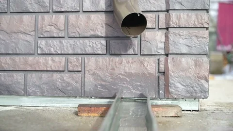 Concept of spring mood. Snow melting in the sun on the roof as symbol of spring Stock-Footage 74608894