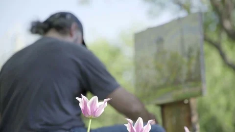 Concept Spring. Skilled Artist Draws Paints of Blossoming Tree. Follow Focus Stock Footage 85071627