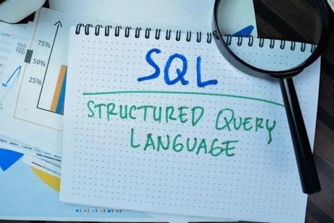 Concept of SQL - Structured Query Language write on book Stock Photos