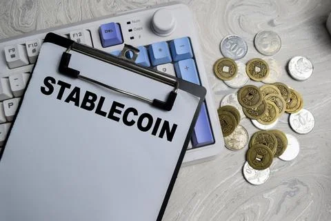 Concept of Stablecoin write on paperwork isolated on Wooden Table. Stock Photos
