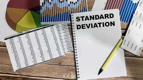 Concept of Standard Deviation write on book isolated on Wooden Table. Stock Photos