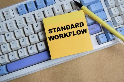 Concept of standard workflow write on sticky notes isolated on keyboard. Stock Photos